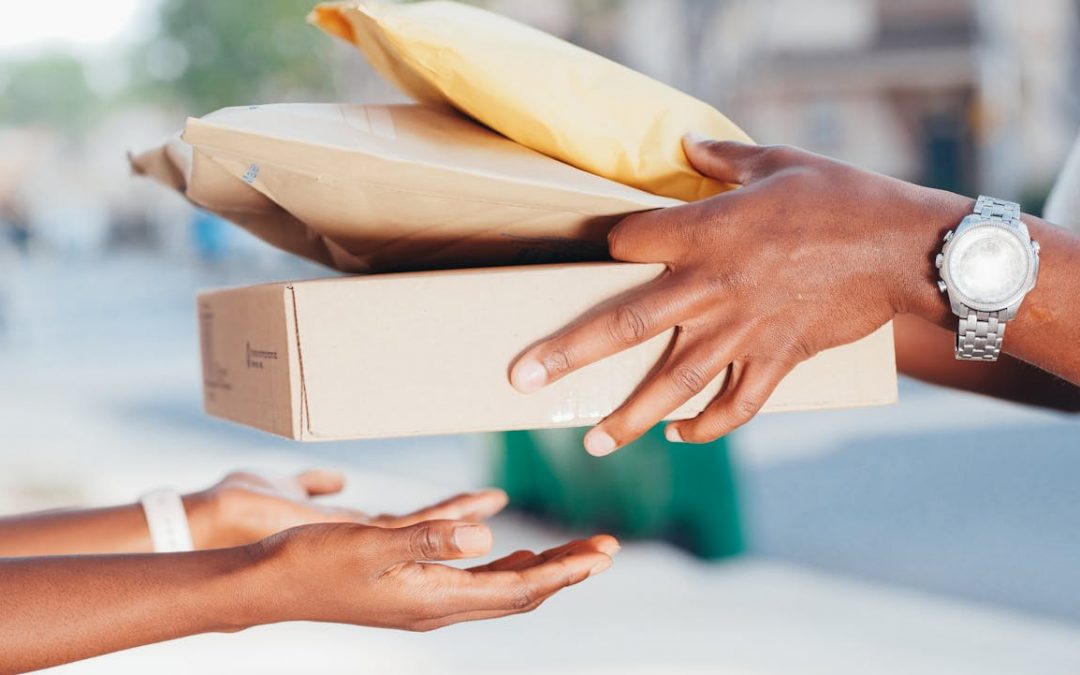 A package is exchanged between two people, highlighting the Document Courier Service in Singapore.